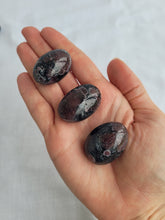 Load image into Gallery viewer, Garnet in Arfvendsonite Tumbles